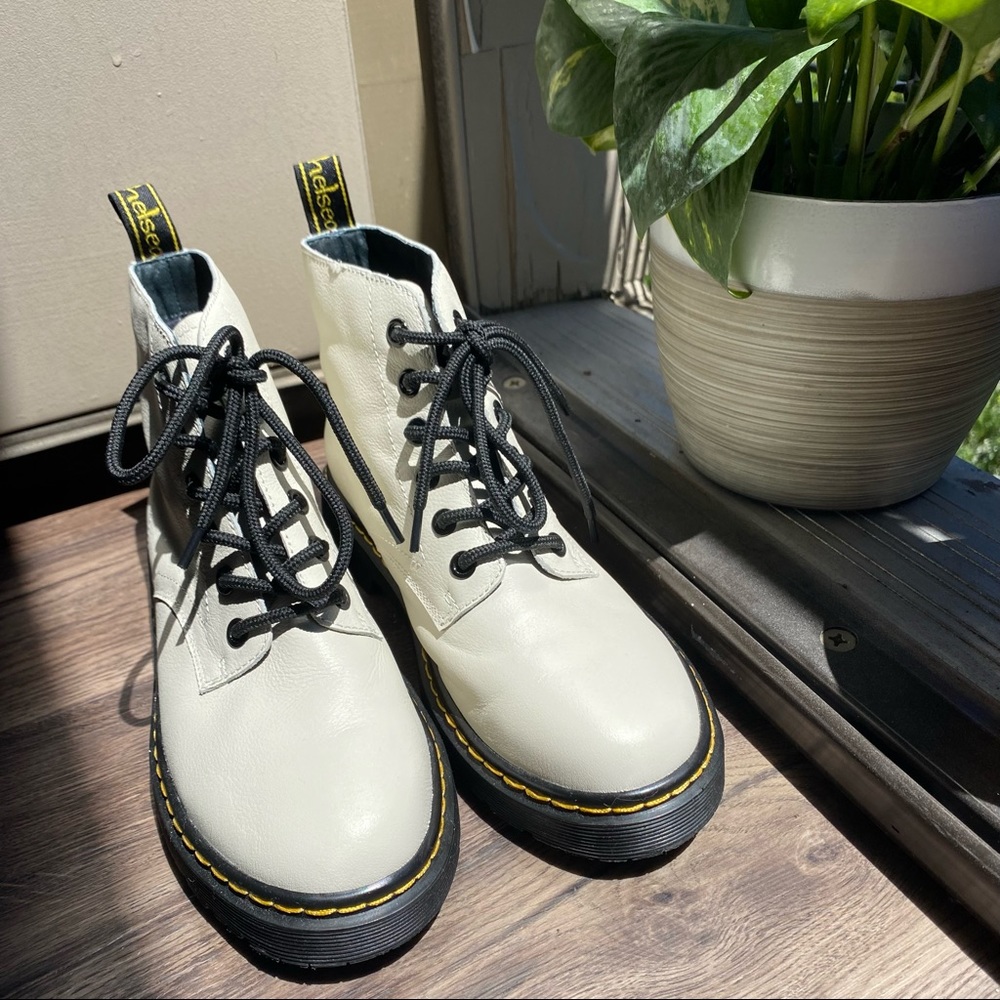new white boots with black shoelaces